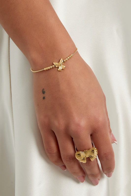 Armband met strikje en kraaltjes - Goud